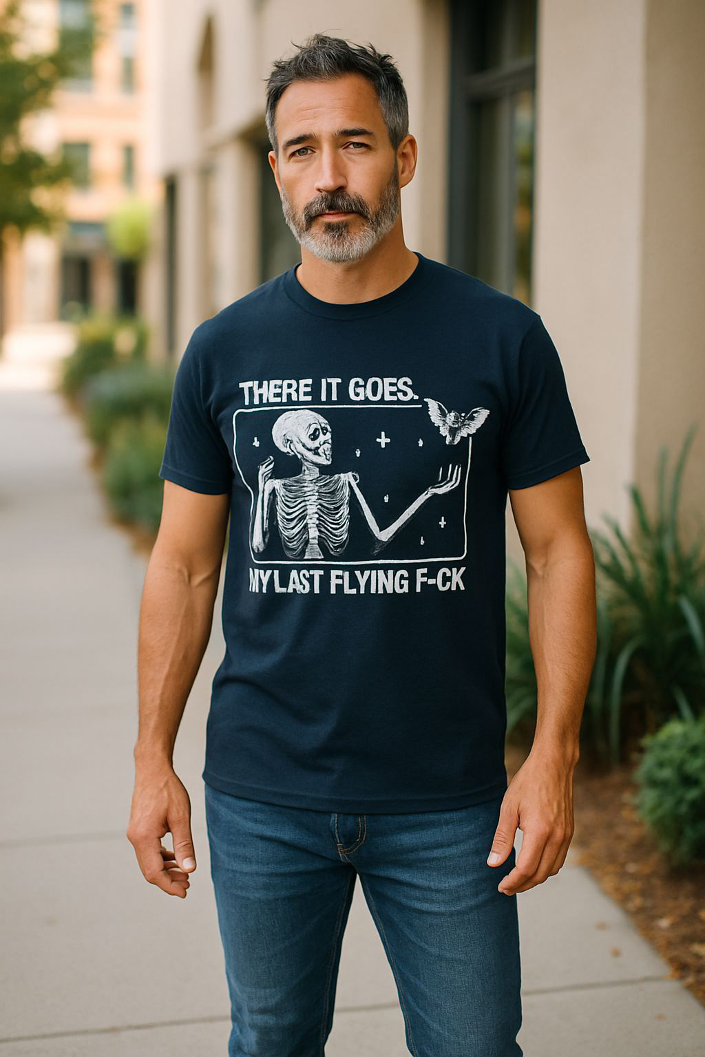 Man wearing a black Halloween tee with skeleton and text "There it goes. My last flying f-ck" in white print