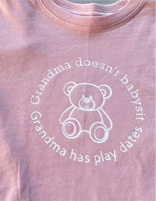 Toddler pink tee shirt with teddy bear and "Grandma doesn't babysit, Grandma has play dates" text design