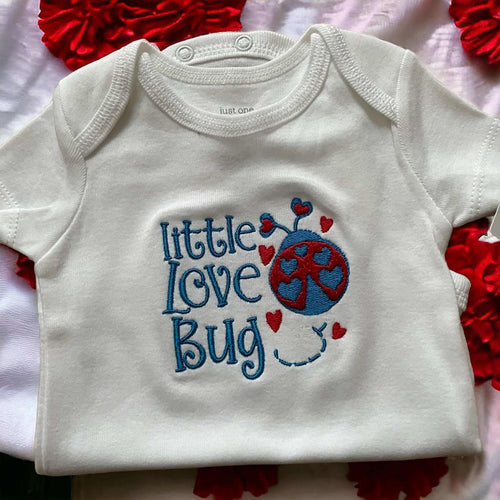 White baby onesie with embroidered blue and red "Little Love Bug" design and hearts, cozy cotton baby clothing, perfect shower gift