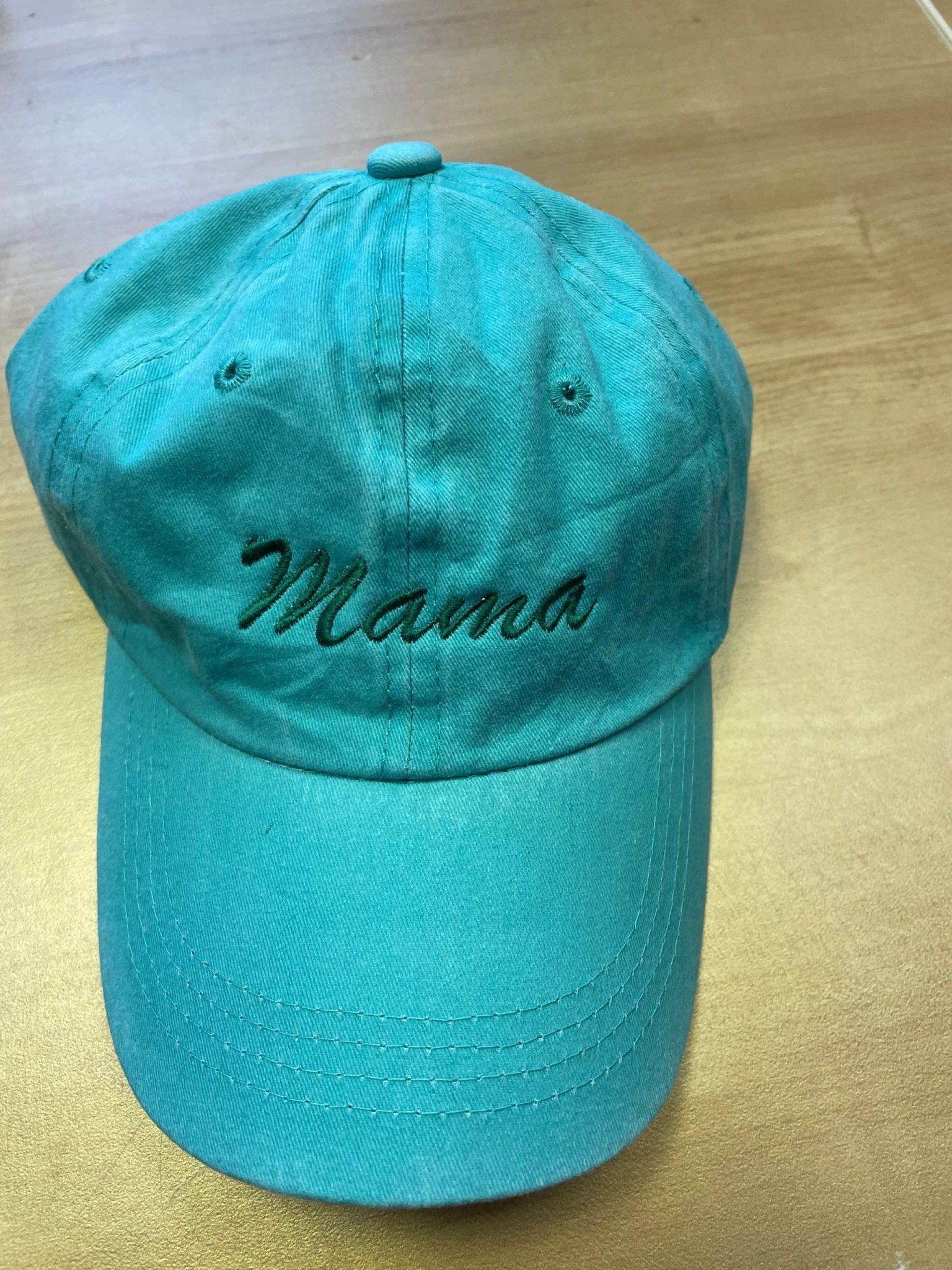 Teal cotton baseball hat with Mama embroidery and adjustable strap