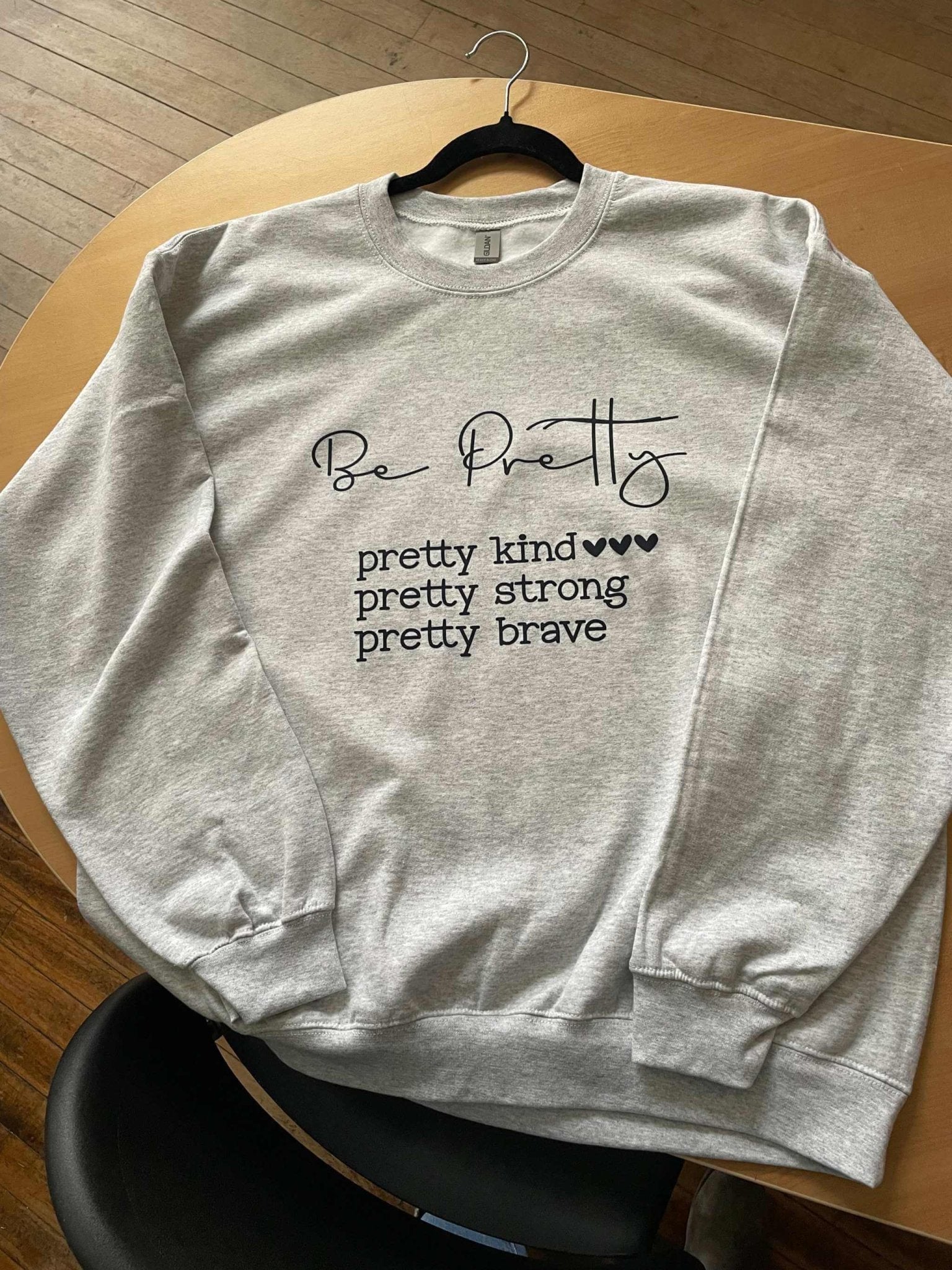 Grey cotton crewneck sweatshirt with Be Pretty text and inspirational message, comfortable casual wear brave crewneck sweatshirt