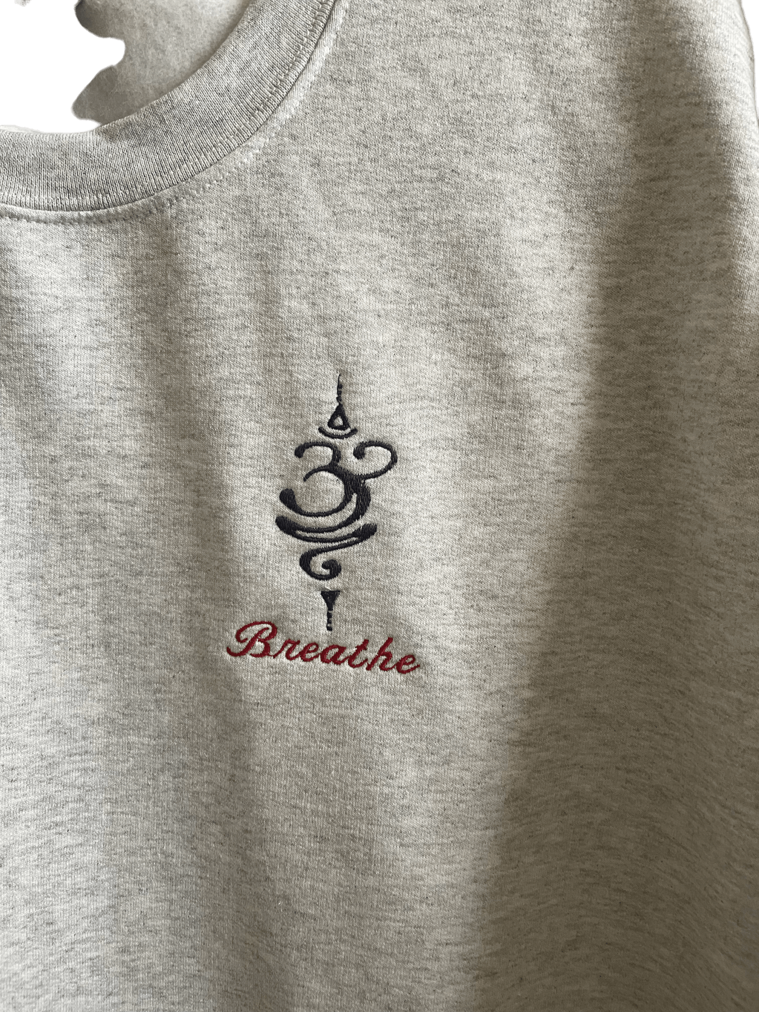 Breathe Grey cotton crewneck sweatshirt with embroidered design and text on soft fabric