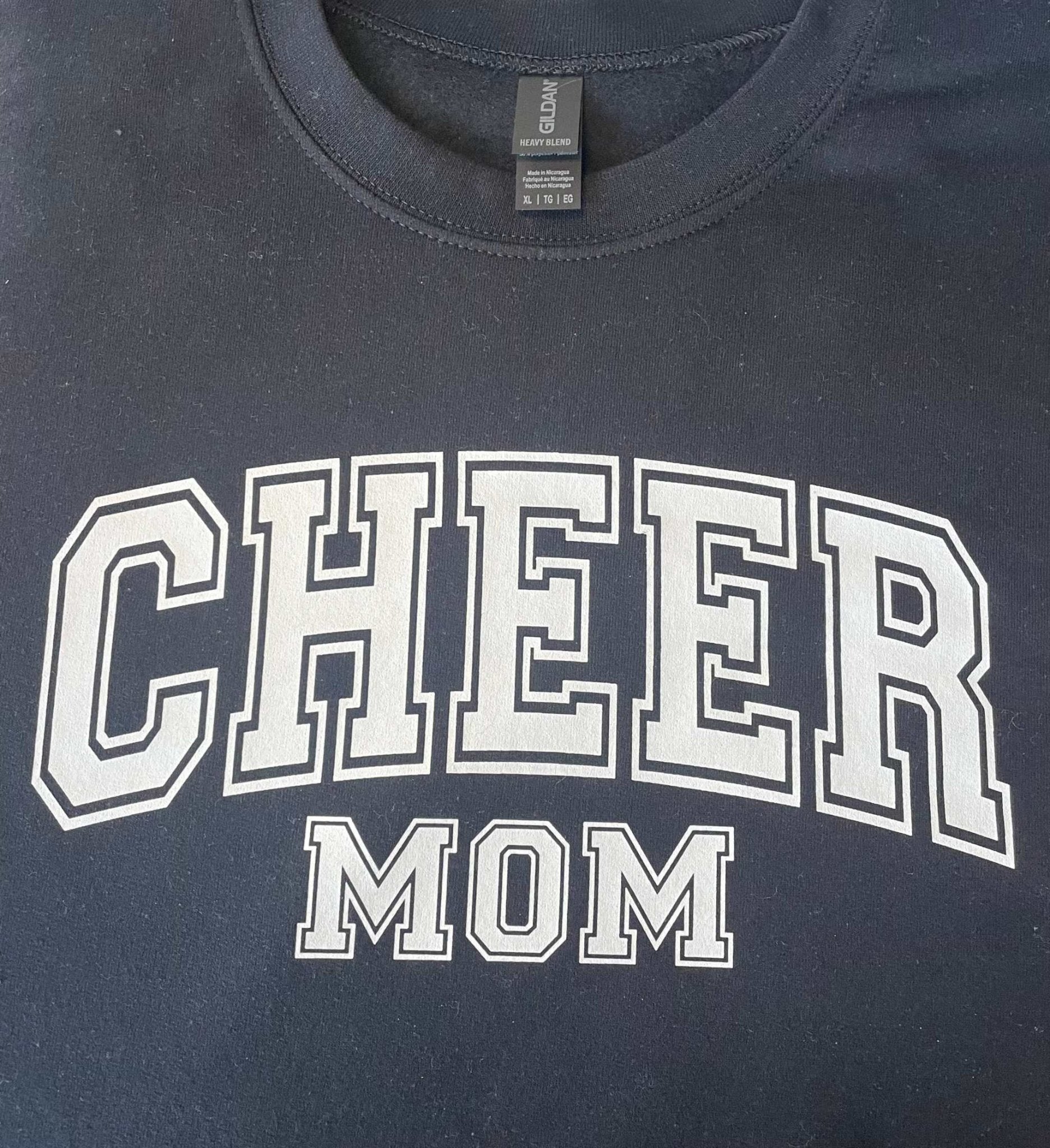 Black crewneck sweatshirt with Cheer Mom text in white letters