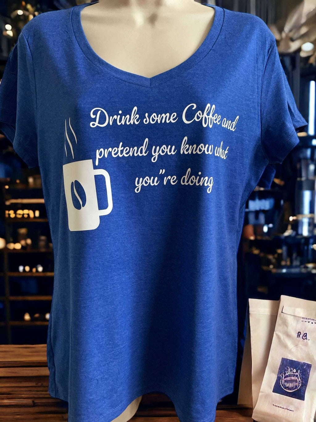 Blue cotton blend V-neck coffee lover tee shirt with humorous coffee quote and mug illustration