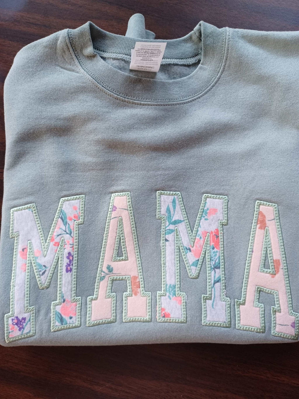 Gray crewneck sweatshirt with embroidered floral "MAMA" design, personalized Mother's Day gift.