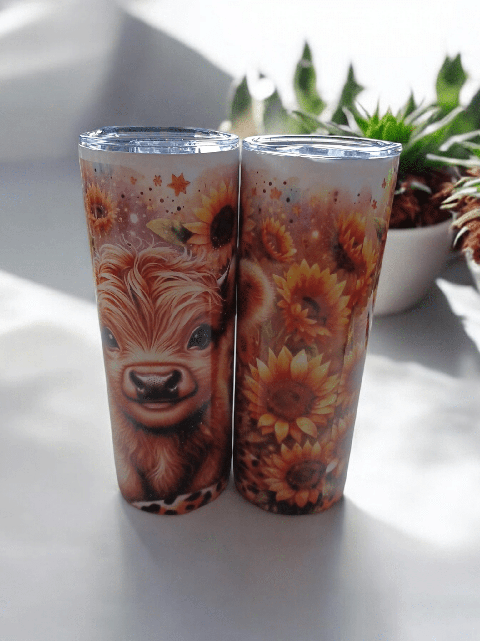 Double wall tumblers with sunflower and animal design, stainless steel, insulated for hot and cold drinks, leak-proof lid.