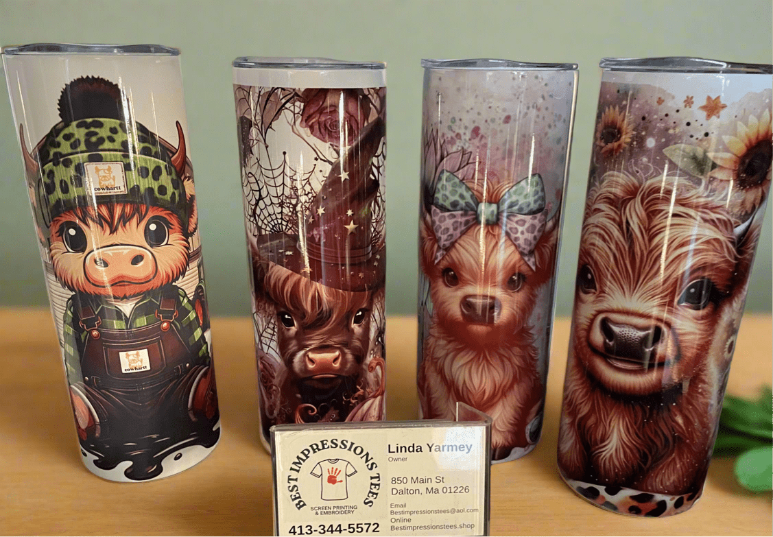 Double wall tumblers with colorful animal and nature designs, stainless steel insulated drinkware with spill-proof lids for hot and cold beverages.