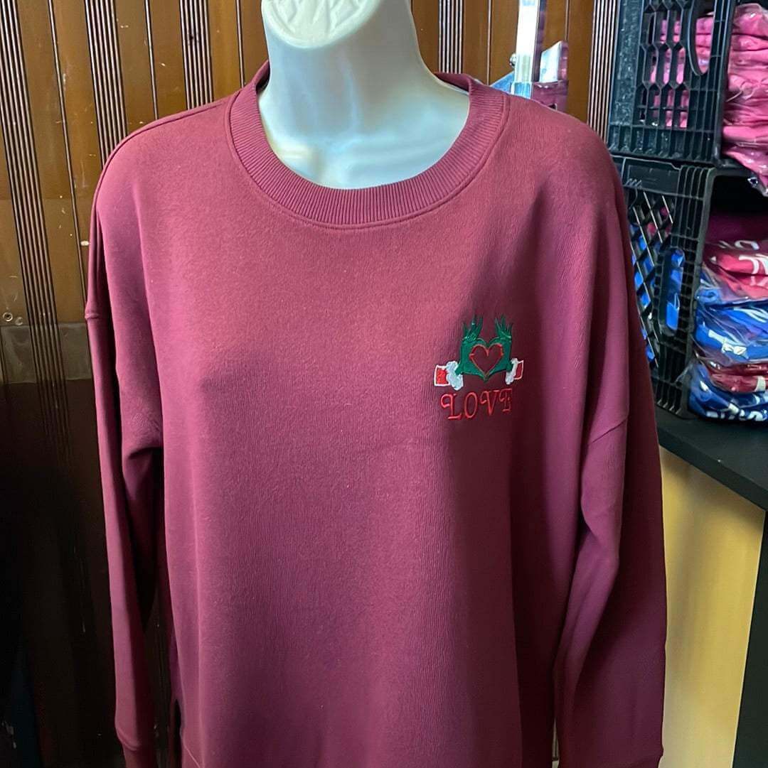 Festive Christmas Red Sweater with embroidered Grinch hands and heart design on cotton blend fabric