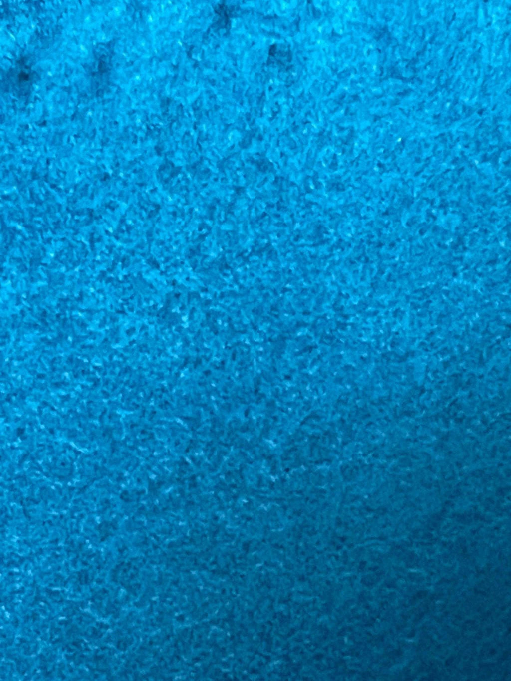 Close-up of blue soft fleece fabric texture for fleece neck warmer