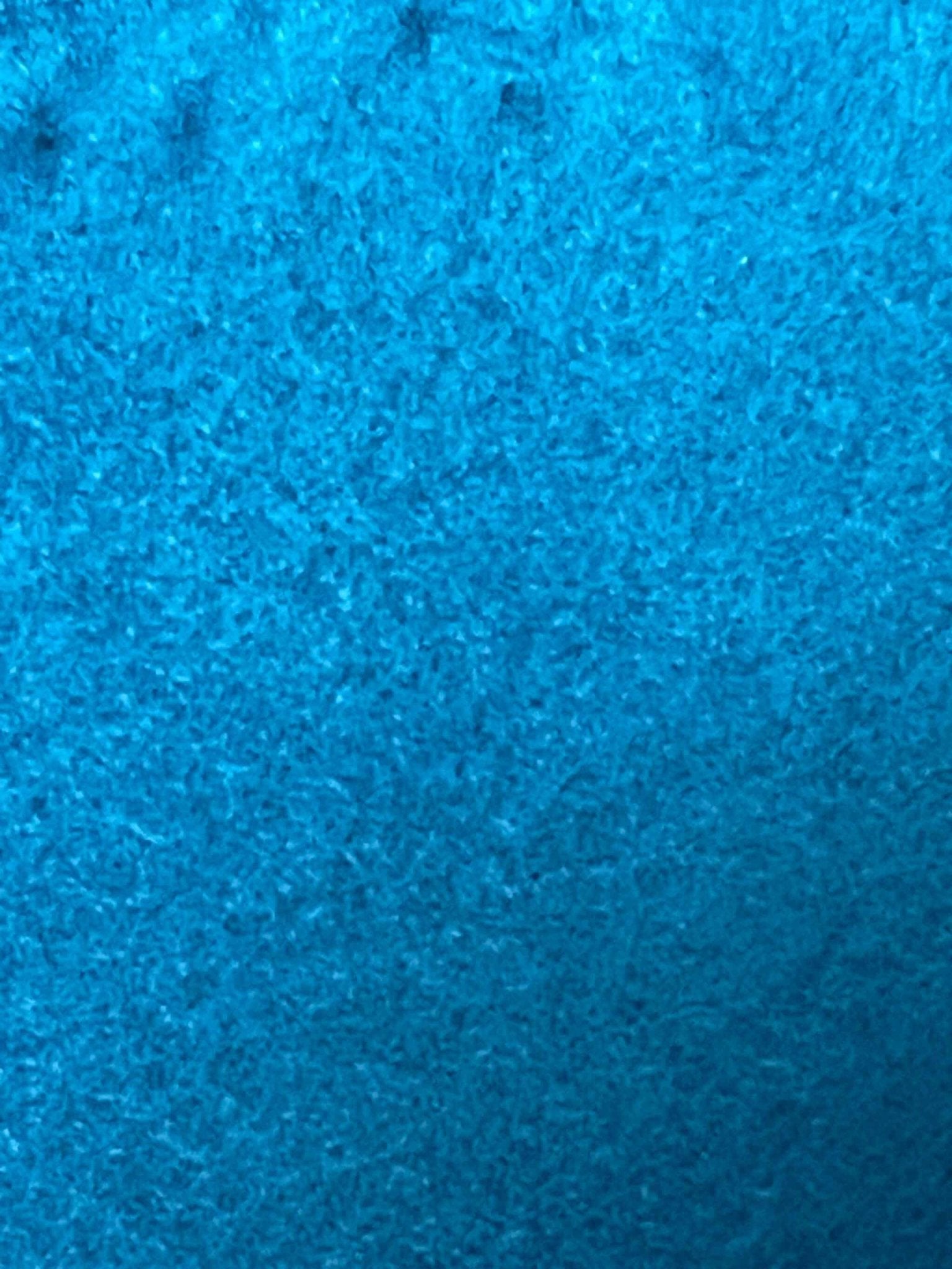 Close-up of blue soft fleece fabric texture for fleece neck warmer