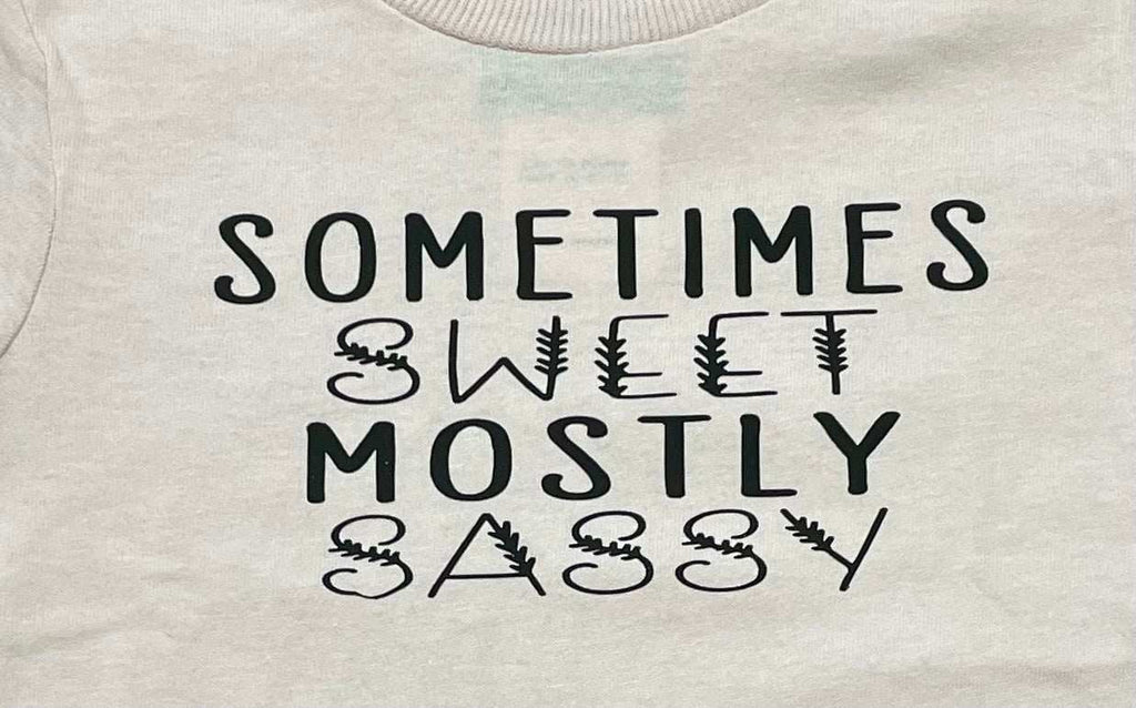 White toddler graphic tee with "Sometimes Sweet Mostly Sassy" text design