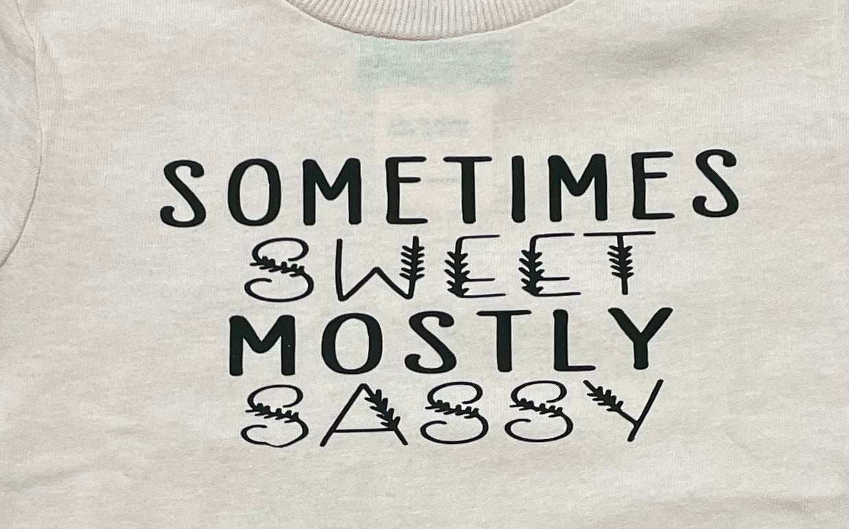 White toddler graphic tee with "Sometimes Sweet Mostly Sassy" text design