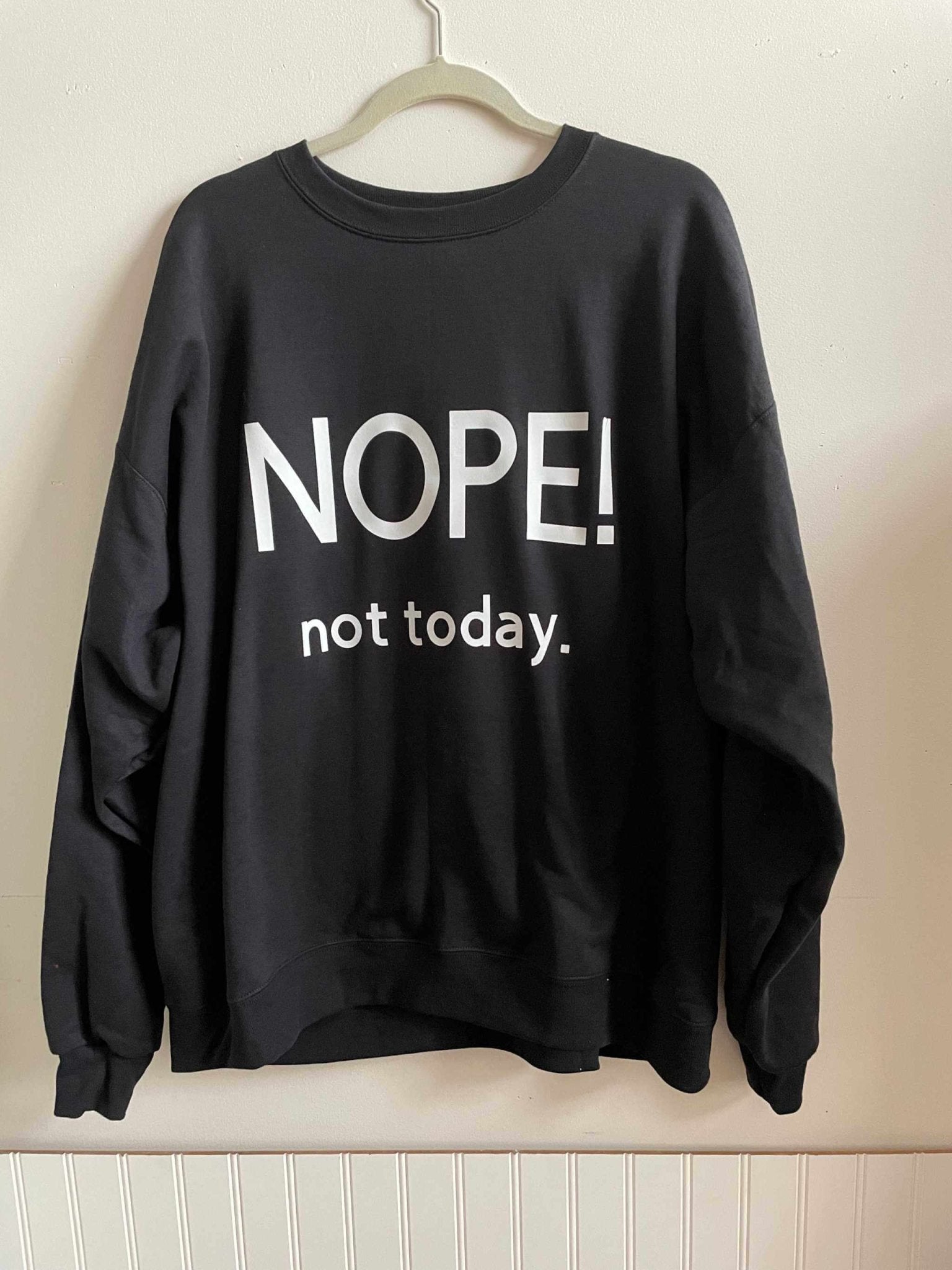 Black cotton crewneck sweatshirt with "Nope! not today." text, made from warm cotton fabric
