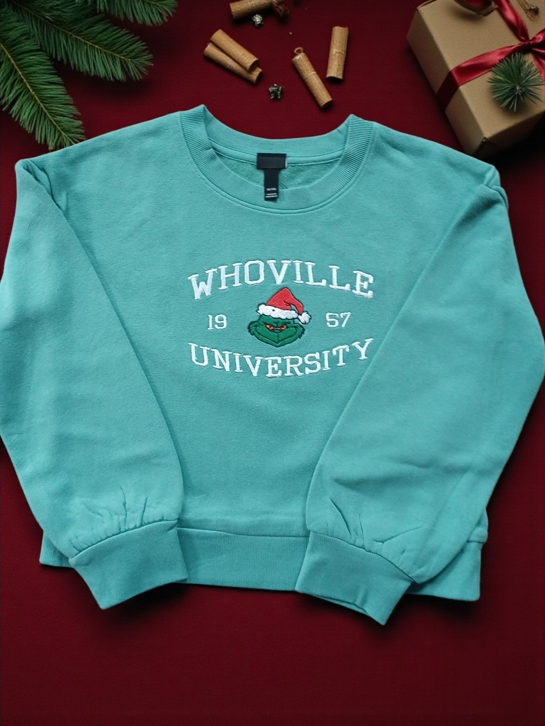 Whoville University kids sweatshirt in green with embroidered design and festive theme