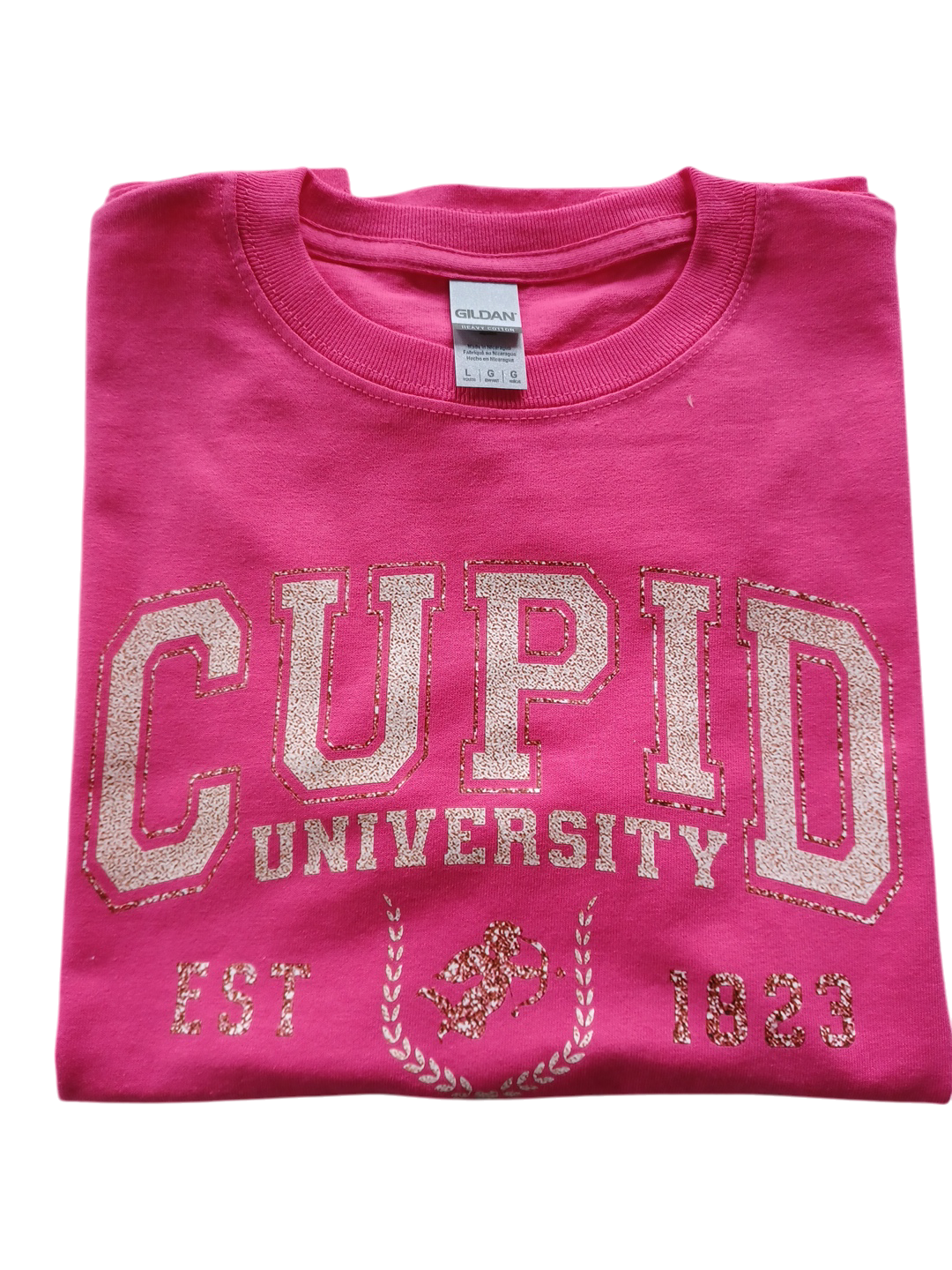 Folded pink youth teeshirt with glittery Cupid University text and design