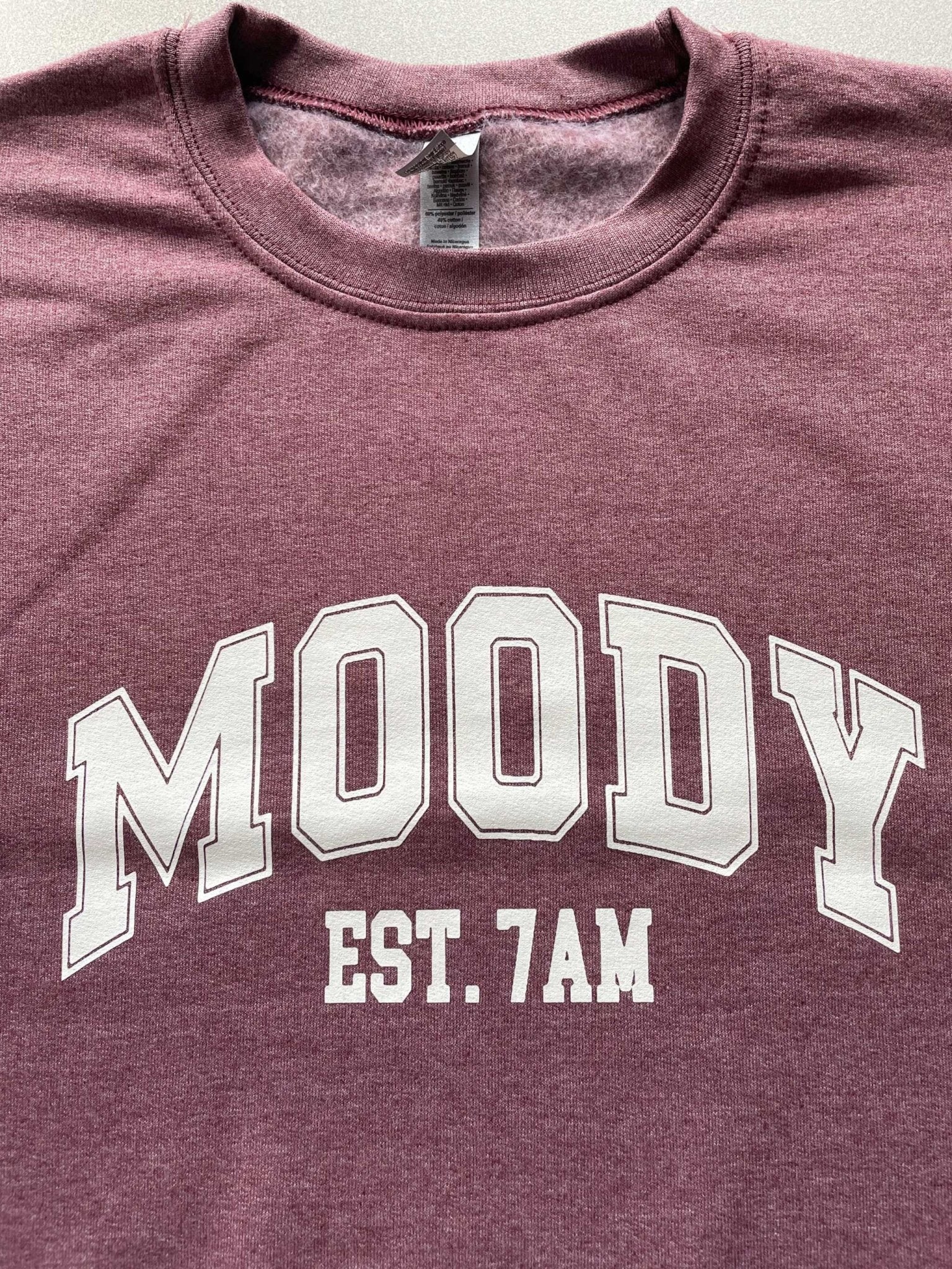 Heather wine cotton sweatshirt with "Moody EST. 7 AM" print, soft and warm crewneck design