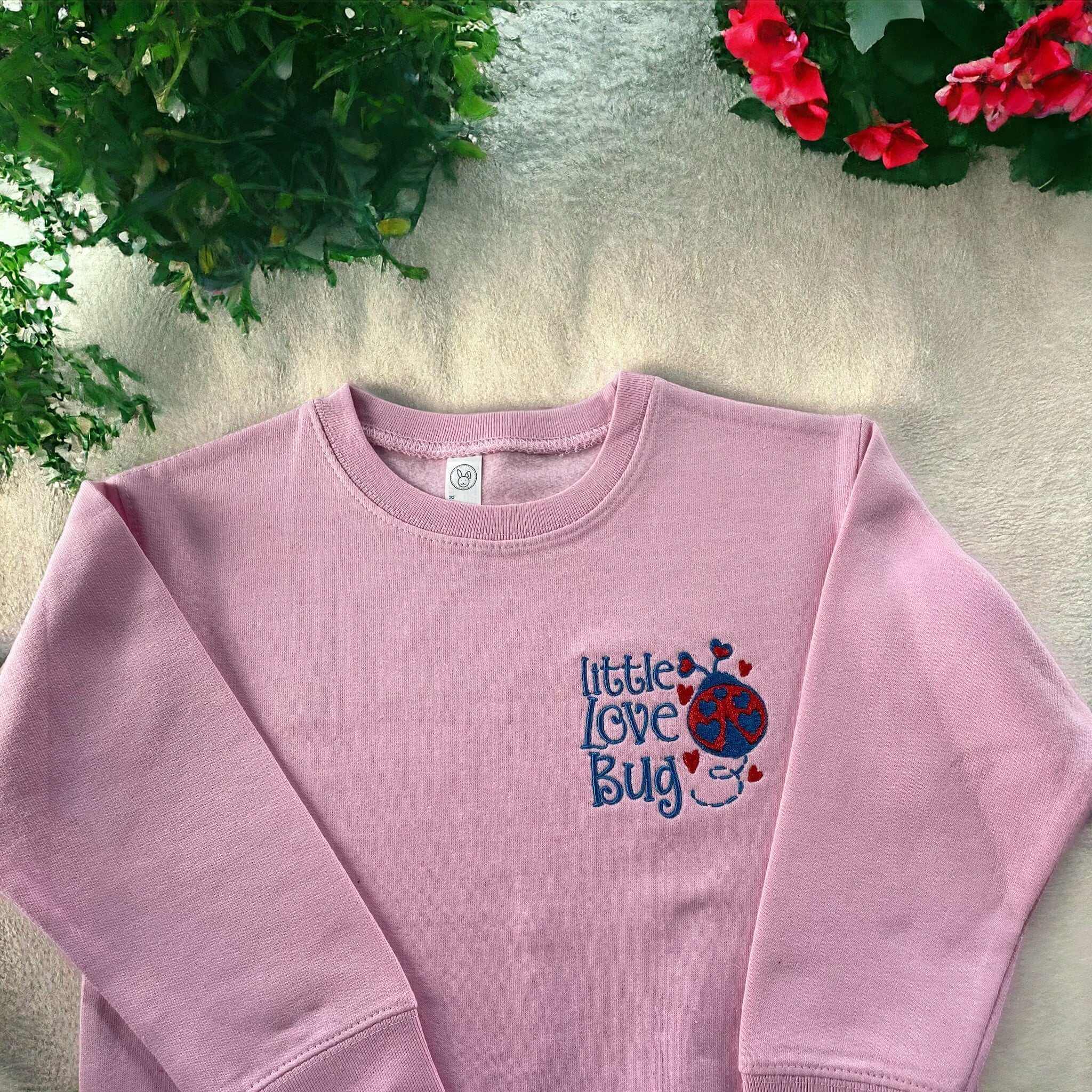 Pink kids sweatshirt with little love bug embroidery and heart details, size 4, machine washable