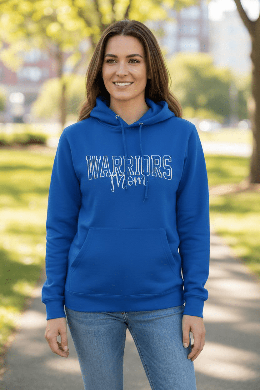 Woman wearing a royal blue Warriors Mom or Dad Sweatshirt hoodie outdoors